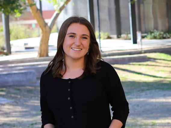 A headshot of Natalie with a tree in the background