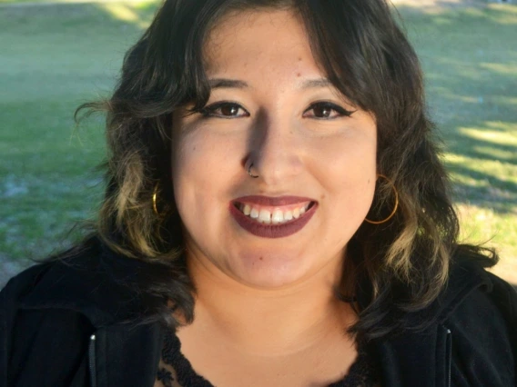 A headshot of Naty, the DCC Director